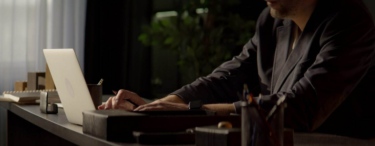 1280x500-man-desk-working-computer